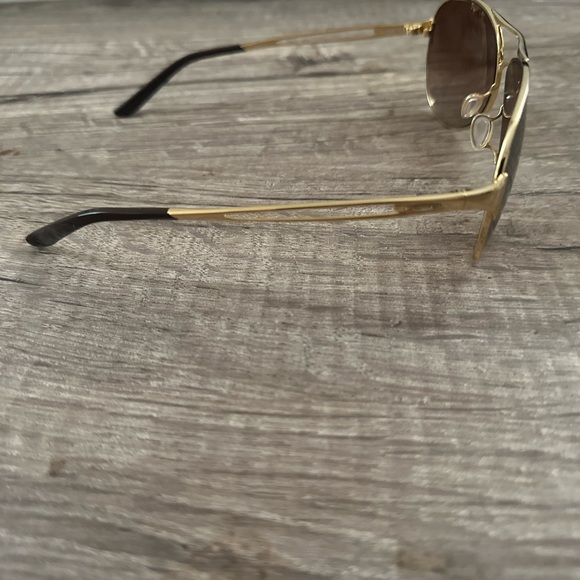 Oakley Sunglasses Caveat Polished Gold Frame Dark Brown Gradient Lens - Picture 2 of 4